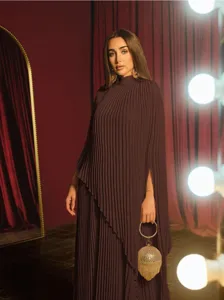 Elegant dark purple pleated two-piece set, loose irregular top and matching skirt.
