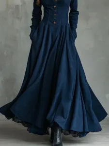 Detail view of vintage dark blue faux suede long dress with lace trim and buttons.