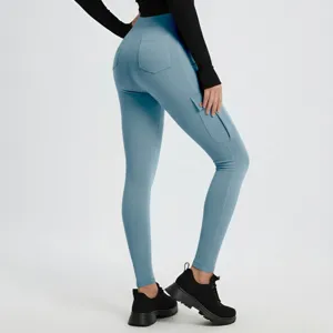 Detail view of women's blue skinny yoga leggings featuring cargo pockets and butt-lifting fit.