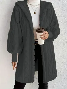 Close-up detail of the cozy loose fluffy hooded long sleeve coat texture and cuff design.