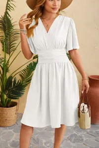 Detailed view of women white v-neck midi dress featuring gathered waist and chic flare sleeves.