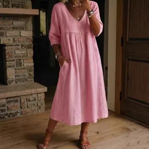 Detail view of casual loose V-neck lace-trimmed linen cotton midi dress for women.