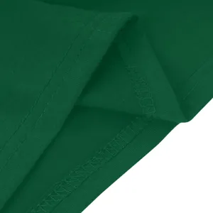 Gedetailleerd overzicht van de groene effen stofstiksels en nauwkeurige afwerking.