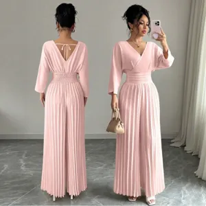 Elegant V-neck solid color short sleeve pleated jumpsuit with wide leg pants for women.