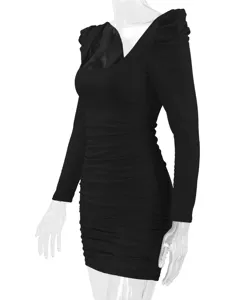 Detail view of the black long sleeve ruched bodycon dress, showing texture and fit clearly.