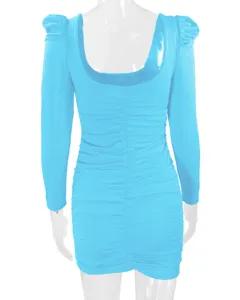 Bright blue long sleeve ruched bodycon dress detail view, showcasing the stylish puff shoulders.