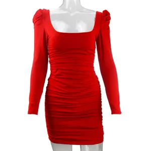 Close-up detail of the elegant red long sleeve ruched bodycon dress with chic square neckline.