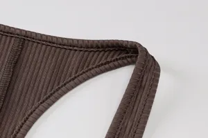 Brown ribbed knit bodysuit detail shot highlighting stretch fabric and neat stitching.
