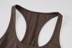 Detailed view of the brown ribbed knit activewear top, showing fine texture and stitching.