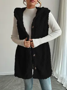 Close-up detail of the black fuzzy hooded vest texture, showing soft teddy fleece fabric.