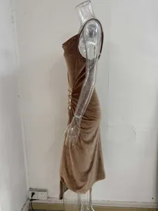 Detail view of glitter velvet cowl neck bodycon side slit slip dress in bronze color.