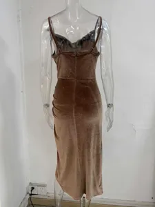 Brown velvet slip dress, featuring cowl neck, fitted waist, and side slit detail.