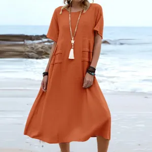 Summer casual solid color linen midi dress with short sleeves and round neck for women.