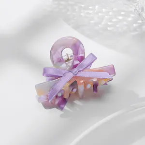 Molla per capelli in acetato viola da donna, elegante design con fiocco, accessorio chic quotidiano.