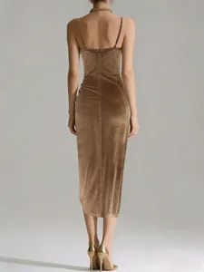 Detailed back view of the glittering gold velvet slip dress, showcasing slim fit and midi length.
