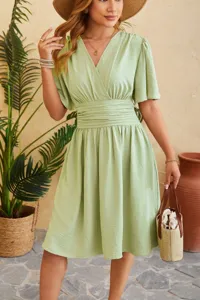 Sage green V-neck flutter sleeve midi dress detail showing the elastic cinched waist design.