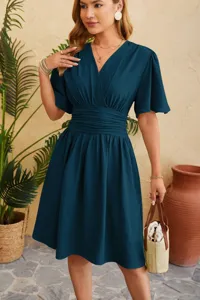 Detailed view of the elegant V-neck flare sleeve midi dress in dark teal, crafted for chic style.