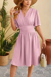 Chic pink v-neck short sleeve waist-cinching dress with ruffled details for women.
