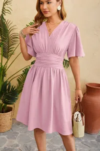 V-neck short sleeve flared dress detail, elegant pink pleated waist design for summer style.