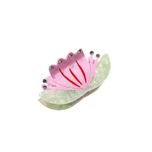 Acetate hair claw clip featuring elegant flower design with crystal rhinestones for daily styling.