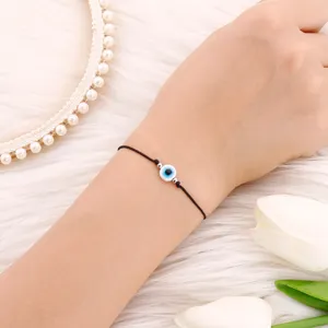 Bracelet cordon noir avec oeil bleu porte-bonheur minimaliste bijoux tendance pour femme et homme