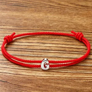 Red braided rope alphabet G charm bracelet, stylish couple jewelry accessory for daily wear.