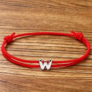 Red braided string bracelet with silver letter W charm, adjustable lucky couple jewelry.