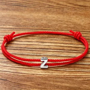 Red braided rope bracelet featuring a silver letter Z charm, adjustable couple jewelry gift.