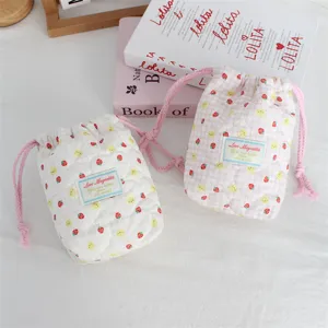 Quilted drawstring camera bag, cute strawberry bunny print storage pouch for outdoor travel.