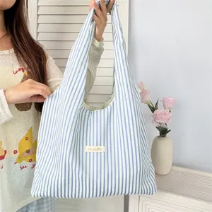 Casual striped canvas shoulder tote bag for women, large capacity daily shopping bag.