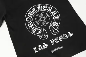 Close-up of Gothic text print on black cotton T-shirt