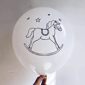 Close-up view of a white latex party balloon featuring a black rocking horse print