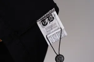 Close-up detail of Chrome Hearts inspired t-shirt wash label and brand tag
