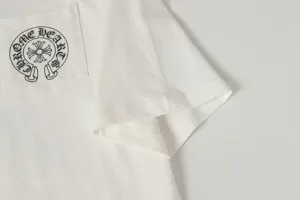 Close-up of white t-shirt pocket with black classic logo print detail