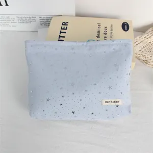 Blue cosmetic bag with silver stars and sequins, large capacity portable makeup pouch.