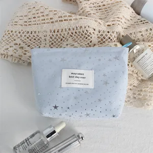 Light blue cosmetic bag with silver star sequins, large capacity portable makeup pouch for daily use.