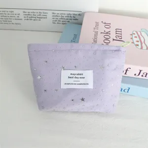 Light purple cosmetic bag with silver stars and dot sequins, portable makeup storage pouch.