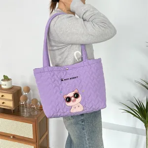 Light purple quilted tote bag with heart pattern and cute cartoon pig embroidery for daily use.
