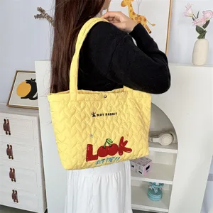 Quilted heart pattern tote bag with cute cherry embroidery, ideal for daily shopping and casual use.