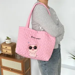 Pink quilted tote bag with cute pig embroidery, large capacity shoulder bag for daily commute.