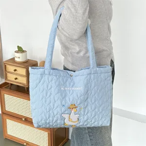 Light blue quilted tote bag with cute duck embroidery, soft large capacity shoulder bag.