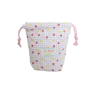 Quilted drawstring pouch for camera and small items, cute strawberry and rabbit pattern.