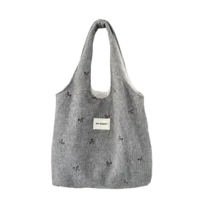 Grijs wollen shopper tas met strik borduursel, chique veelzijdige schoudertas voor dames.