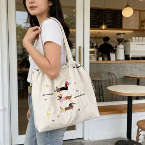 Borsa a tracolla in tela con ricamo di bassotto carino vista dettagliata, borsa casual giornaliera.