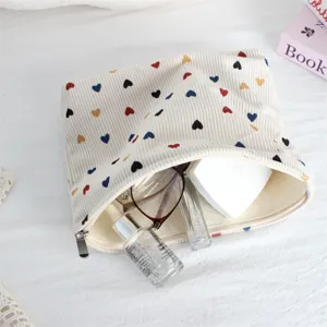Corduroy makeup bag with colorful heart print, cute zipper cosmetic pouch and travel organizer.
