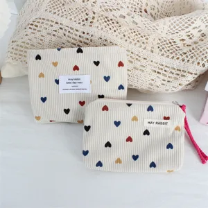 Corduroy cosmetic bag with colorful heart print, cute portable zipper storage pouch for daily use.