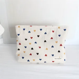 Corduroy cosmetic bag with colorful heart print, portable daily makeup storage pouch.