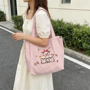 Vista detallada del bolso de lona rosa, bolso de hombro casual con bordado de cerdito tierno.