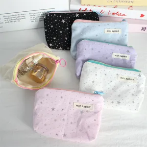 Canvas cosmetic pouch with silver star print, portable zipper makeup bag for daily essentials.