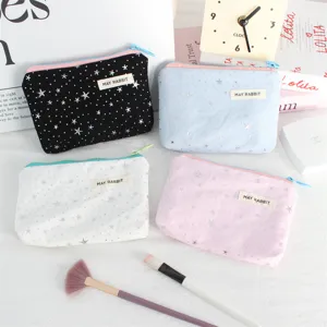 Detailed view of cute star sequin cosmetic pouch set, portable storage bag for makeup essentials.